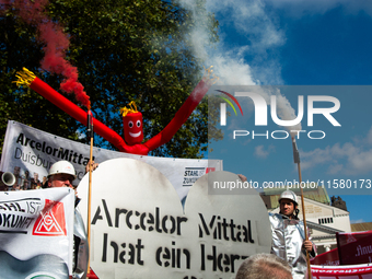 IGM labor union calls for thousands of steel workers to protest in front of Mercatorhall during the national steel summit in Duisburg, Germa...