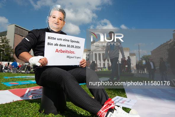 A protester with a Lopez Borrego face mask, the CEO of Thyssenkrupp, is seen as the IGM labor union calls for thousands of steel workers to...