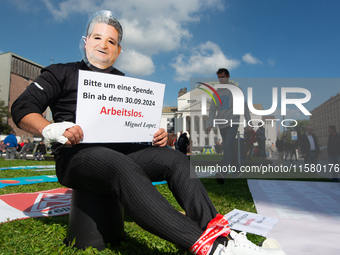 A protester with a Lopez Borrego face mask, the CEO of Thyssenkrupp, is seen as the IGM labor union calls for thousands of steel workers to...