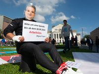 A protester with a Lopez Borrego face mask, the CEO of Thyssenkrupp, is seen as the IGM labor union calls for thousands of steel workers to...