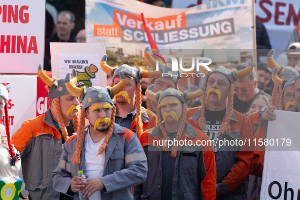 IGM labor union calls for thousands of steel workers to protest in front of Mercatorhall during the national steel summit in Duisburg, Germa...