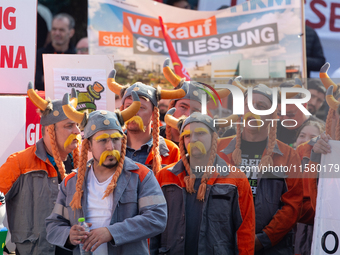 IGM labor union calls for thousands of steel workers to protest in front of Mercatorhall during the national steel summit in Duisburg, Germa...