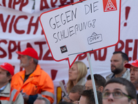 IGM labor union calls for thousands of steel workers to protest in front of Mercatorhall during the national steel summit in Duisburg, Germa...