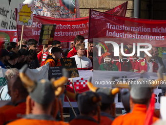 IGM labor union calls for thousands of steel workers to protest in front of Mercatorhall during the national steel summit in Duisburg, Germa...