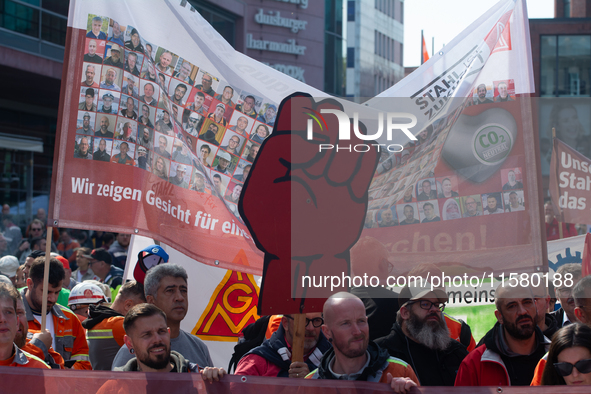 IGM labor union calls for thousands of steel workers to protest in front of Mercatorhall during the national steel summit in Duisburg, Germa...