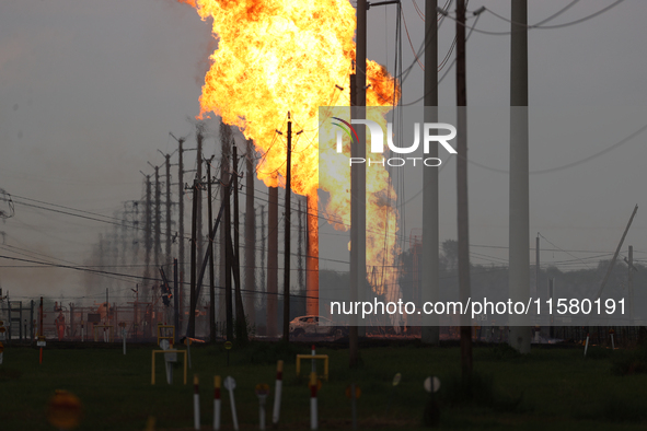 In Pasadena, Texas, a suburb of Houston, on September 16, 2024, a pipeline fire burns throughout the day. The fire is visible up to twenty m...