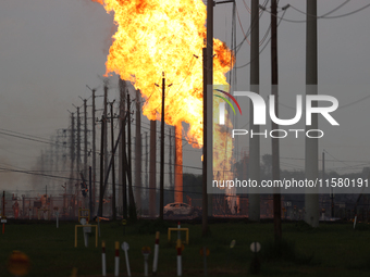 In Pasadena, Texas, a suburb of Houston, on September 16, 2024, a pipeline fire burns throughout the day. The fire is visible up to twenty m...