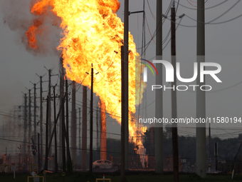 In Pasadena, Texas, a suburb of Houston, on September 16, 2024, a pipeline fire burns throughout the day. The fire is visible up to twenty m...