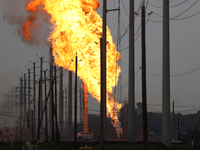 In Pasadena, Texas, a suburb of Houston, on September 16, 2024, a pipeline fire burns throughout the day. The fire is visible up to twenty m...