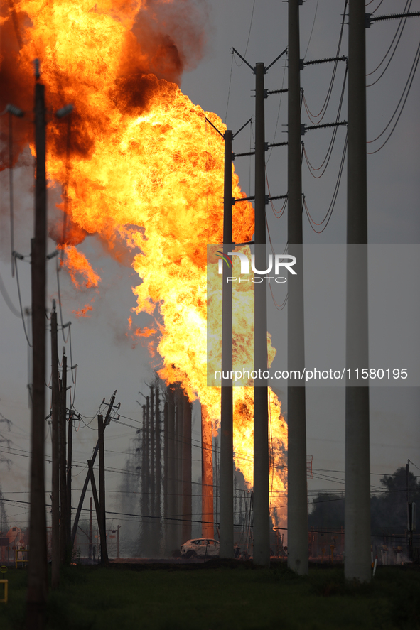 In Pasadena, Texas, a suburb of Houston, on September 16, 2024, a pipeline fire burns throughout the day. The fire is visible up to twenty m...