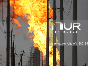 In Pasadena, Texas, a suburb of Houston, on September 16, 2024, a pipeline fire burns throughout the day. The fire is visible up to twenty m...