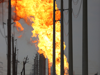 In Pasadena, Texas, a suburb of Houston, on September 16, 2024, a pipeline fire burns throughout the day. The fire is visible up to twenty m...