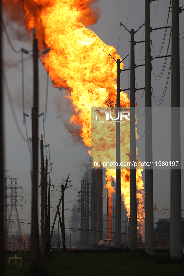 In Pasadena, Texas, a suburb of Houston, on September 16, 2024, a pipeline fire burns throughout the day. The fire is visible up to twenty m...