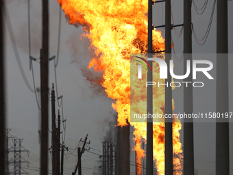 In Pasadena, Texas, a suburb of Houston, on September 16, 2024, a pipeline fire burns throughout the day. The fire is visible up to twenty m...