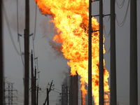 In Pasadena, Texas, a suburb of Houston, on September 16, 2024, a pipeline fire burns throughout the day. The fire is visible up to twenty m...