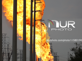 In Pasadena, Texas, a suburb of Houston, on September 16, 2024, a pipeline fire burns throughout the day. The fire is visible up to twenty m...