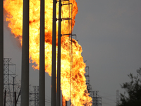 In Pasadena, Texas, a suburb of Houston, on September 16, 2024, a pipeline fire burns throughout the day. The fire is visible up to twenty m...