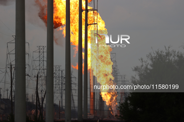 In Pasadena, Texas, a suburb of Houston, on September 16, 2024, a pipeline fire burns throughout the day. The fire is visible up to twenty m...