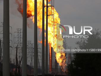 In Pasadena, Texas, a suburb of Houston, on September 16, 2024, a pipeline fire burns throughout the day. The fire is visible up to twenty m...