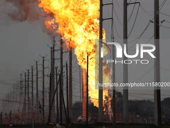 In Pasadena, Texas, a suburb of Houston, on September 16, 2024, a pipeline fire burns throughout the day. The fire is visible up to twenty m...