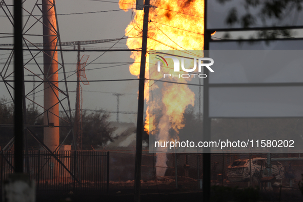 In Pasadena, Texas, a suburb of Houston, on September 16, 2024, a pipeline fire burns throughout the day. The fire can be seen up to twenty...