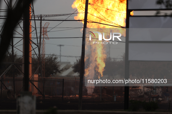 In Pasadena, Texas, a suburb of Houston, on September 16, 2024, a pipeline fire burns throughout the day. The fire can be seen up to twenty...