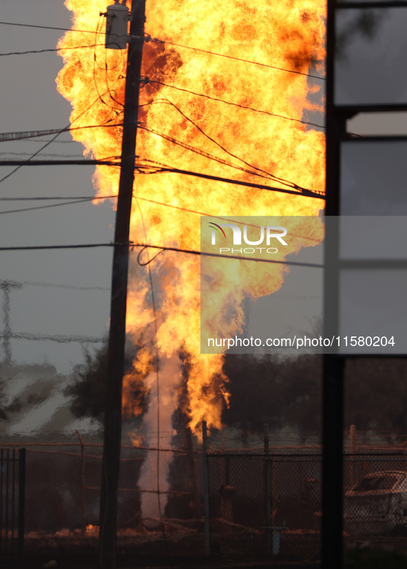 In Pasadena, Texas, a suburb of Houston, on September 16, 2024, a pipeline fire burns throughout the day. The fire can be seen up to twenty...