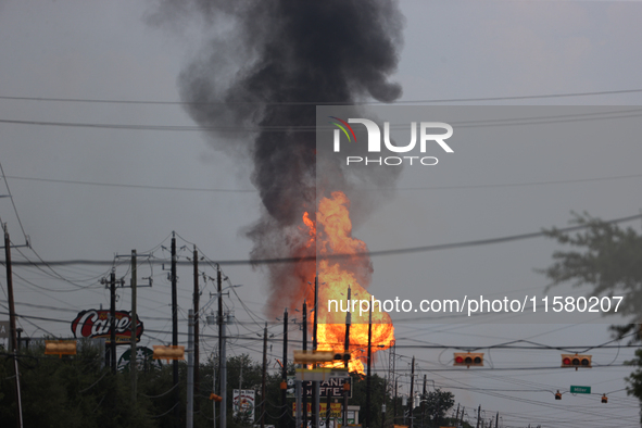 In Pasadena, Texas, a suburb of Houston, on September 16, 2024, a pipeline fire burns throughout the day. The fire is visible up to twenty m...