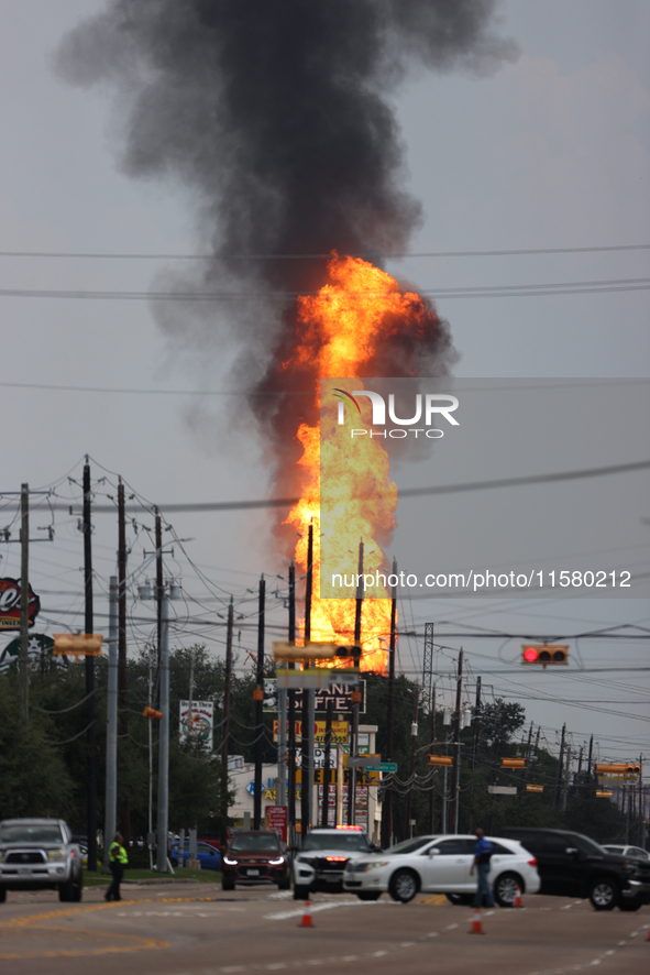 In Pasadena, Texas, a suburb of Houston, on September 16, 2024, a pipeline fire burns throughout the day. The fire is visible up to twenty m...