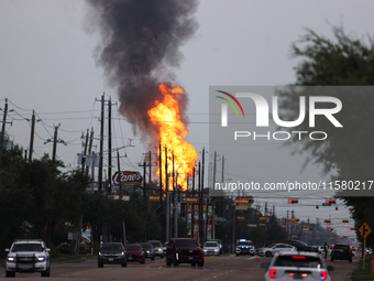 In Pasadena, Texas, a suburb of Houston, on September 16, 2024, a pipeline fire burns throughout the day. The fire is visible up to twenty m...