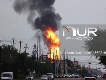 In Pasadena, Texas, a suburb of Houston, on September 16, 2024, a pipeline fire burns throughout the day. The fire is visible up to twenty m...