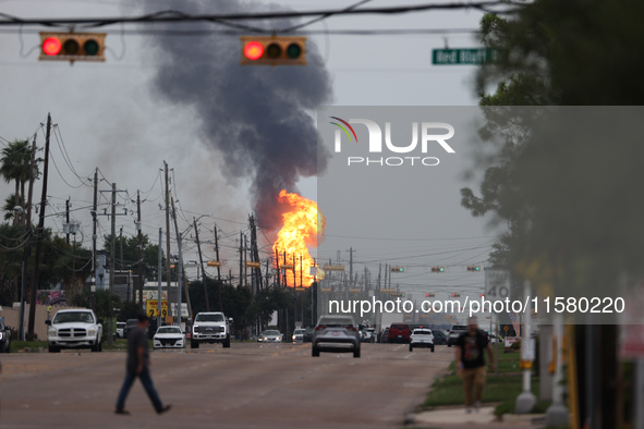 In Pasadena, Texas, a suburb of Houston, on September 16, 2024, a pipeline fire burns throughout the day. The fire is visible up to twenty m...