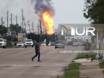 In Pasadena, Texas, a suburb of Houston, on September 16, 2024, a pipeline fire burns throughout the day. The fire is visible up to twenty m...