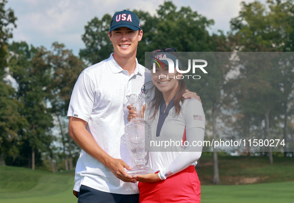 GAINESVILLE, VIRGINIA - SEPTEMBER 15: Alison Lee of the United States poses with her significant other while holding the trophy on the 18th...