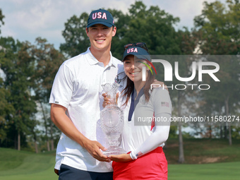 GAINESVILLE, VIRGINIA - SEPTEMBER 15: Alison Lee of the United States poses with her significant other while holding the trophy on the 18th...