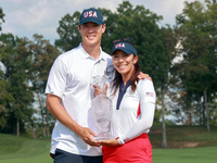 GAINESVILLE, VIRGINIA - SEPTEMBER 15: Alison Lee of the United States poses with her significant other while holding the trophy on the 18th...