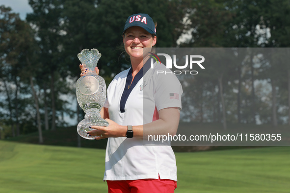 GAINESVILLE, VIRGINIA - SEPTEMBER 15: Ally Ewing of the United States poses with the trophy on the 18th green at the conclusion of the Solhe...