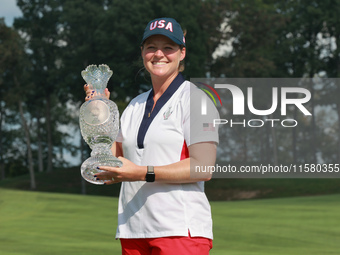 GAINESVILLE, VIRGINIA - SEPTEMBER 15: Ally Ewing of the United States poses with the trophy on the 18th green at the conclusion of the Solhe...