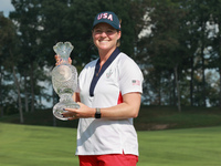 GAINESVILLE, VIRGINIA - SEPTEMBER 15: Ally Ewing of the United States poses with the trophy on the 18th green at the conclusion of the Solhe...