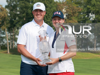 GAINESVILLE, VIRGINIA - SEPTEMBER 15: Ally Ewing of the United States poses with her significan other while holding the trophy on the 18th g...