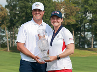 GAINESVILLE, VIRGINIA - SEPTEMBER 15: Ally Ewing of the United States poses with her significan other while holding the trophy on the 18th g...