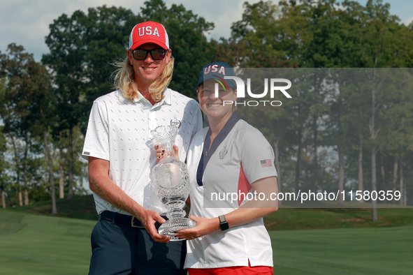 GAINESVILLE, VIRGINIA - SEPTEMBER 15: Ally Ewing of the United States poses with her caddie while holding the trophy on the 18th green at th...