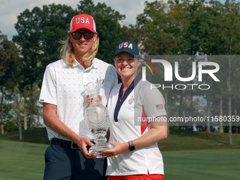 GAINESVILLE, VIRGINIA - SEPTEMBER 15: Ally Ewing of the United States poses with her caddie while holding the trophy on the 18th green at th...