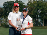 GAINESVILLE, VIRGINIA - SEPTEMBER 15: Ally Ewing of the United States poses with her caddie while holding the trophy on the 18th green at th...