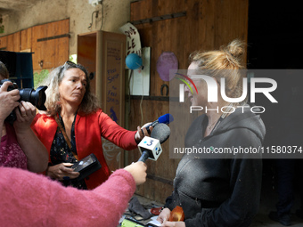 Alexandra, tenant of the Verger, gives a press conference. After months of negotiations and pressures from NGE/Atosca, and two attacks by in...