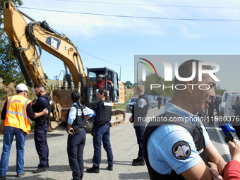 A gendarme gives a press conference as the workers wait to enter the 'Verger' ZAD. After months of negotiations and pressures from NGE/Atosc...