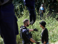 An opponent argues with a Gendarme. After months of negotiations and pressures from NGE/Atosca, and two incendiary attacks, Alexandra, the t...