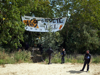 Gendarmes stand guard near the 'Verger' ZAD. The banner reads 'A69, the highway stops there'. After months of negotiations and pressures fro...