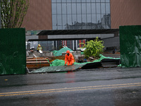 Workers clean up after a fence is blown down at a construction site in Nanjing, Jiangsu province, China, on September 17, 2024. (