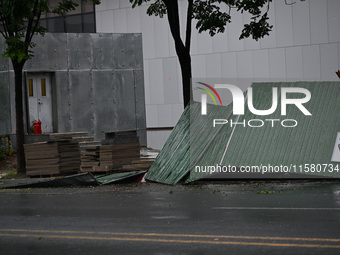 A fence is blown down at a construction site in Nanjing, China, on September 17, 2024. (